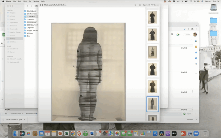 Screenshot of a computer desktop with open applications and files. In the center a photograph of a standing figure with overlaying horizontal lines creating a glitch effect.