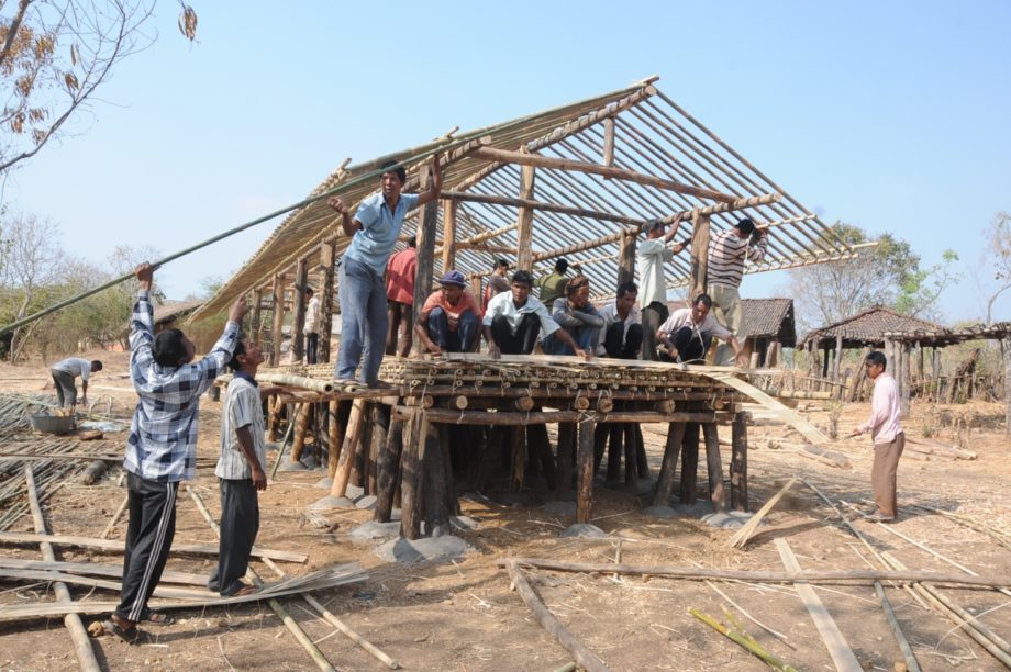 Tribal Habitat under construction by tribal artisans at the Indira Gandhi Rashtriya Manav Sangrahalaya (IGRMS), Bhopal, showing the collaborative reconstruction of life-size tribal dwellings using traditional materials and indigenous building techniques